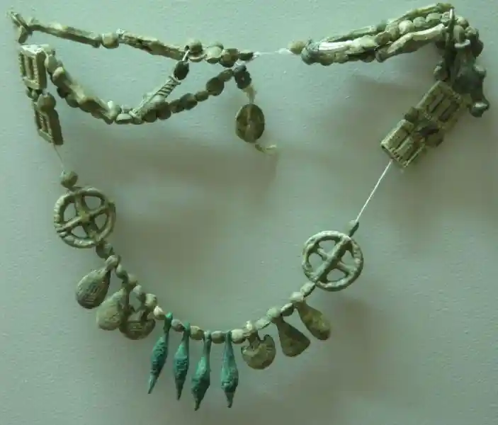 A prechristian cross inside a circle design on a necklace